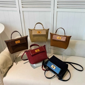 Classic vintage-style trapezoid handbags with metal twist locks and suede finish details
