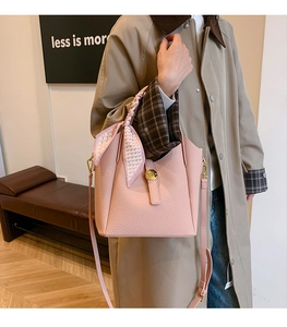 Pink lychee grain leather bucket bag with heart silk scarf handle and gold buckle
