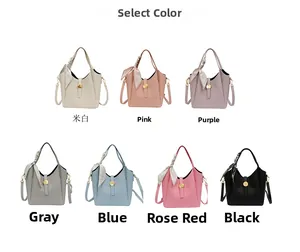 Detailed view of bucket bag color options featuring pebbled leather and silk scarf handle