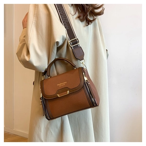 Brown lychee leather handbag with fashion lettering and wide jacquard shoulder strap