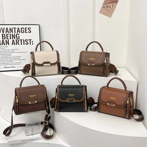 Minimalist pebbled leather handbags in five colors with wide jacquard shoulder straps