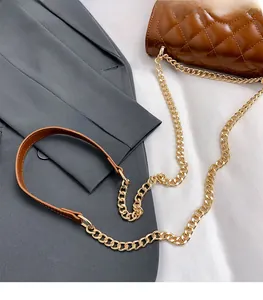 Detail of caramel quilted leather bag featuring a gold chain and leather shoulder strap