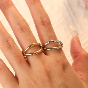 Minimalist irregular wave stacking rings set in gold and silver stainless steel finish