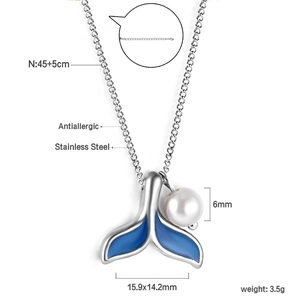 Macro view of mermaid tail pendant with 6mm pearl and stainless steel chain details