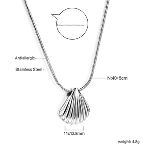 Macro detail of silver stainless steel shell pendant showing 11x12.8mm size and adjustable chain