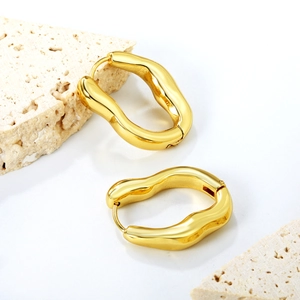 Irregular chunky wave gold earrings in polished stainless steel with modern fluid design