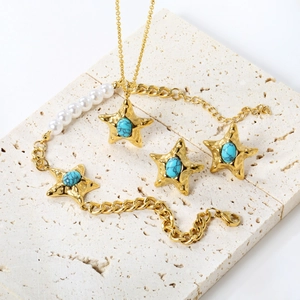 Detail of starfish pendant jewelry set with blue turquoise stones and white pearls