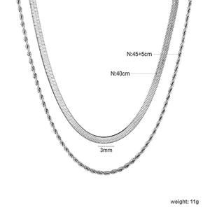 Detail of silver layered necklace set with 3mm flat snake chain and twist chain lengths