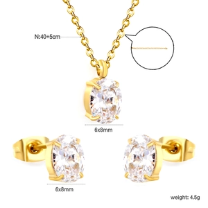 Macro detail of gold stainless steel necklace set with 6x8mm clear oval cubic zirconia stones