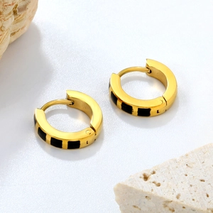 Golden stainless steel hoop earrings with black enamel rectangle pattern details