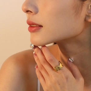 Minimalist gold butterfly open ring for women with textured metal design on finger