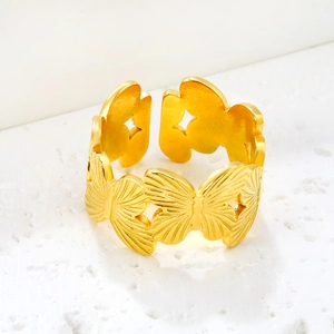 Golden butterfly open ring with textured wing details and minimalist aesthetic design