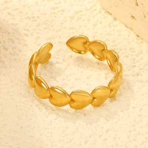 Macro shot of 18K gold plated heart ring with polished finish and open adjustable band