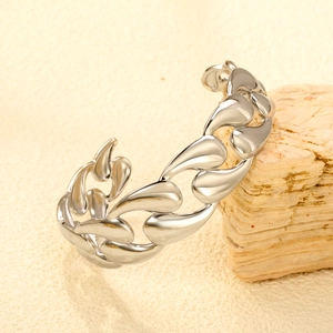 Macro shot of silver irregular water-drop chain link cuff bracelet with high polish finish