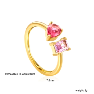Detail view of adjustable gold ring with heart-shaped pink stone and rectangular gem