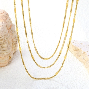Minimalist gold multi-layer sweater chain necklace with flat sequins and tiered chain links