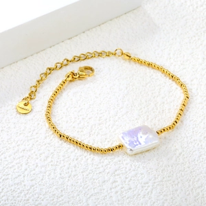 18K gold plated stainless steel bracelet featuring square iridescent faux pearl charm