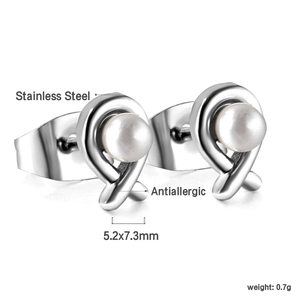 Detail of cross-knot antiallergic stainless steel stud earrings with white pearls