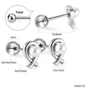 Macro detail of cross knot pearl stud earrings featuring a secure twist screw back closure