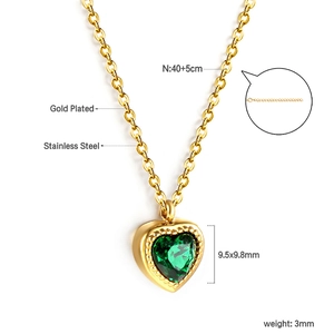 Detailed view of a gold-plated stainless steel necklace with a green heart gemstone
