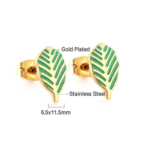 Macro view of gold-plated leaf earrings with green enamel and stainless steel posts