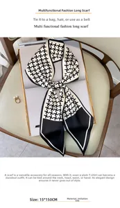 Detail of 15x150cm black and white houndstooth silk scarf on a magazine background