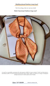 Detailansicht des 15x150cm orangefarbenen Seidenschals mit Paisley-Muster