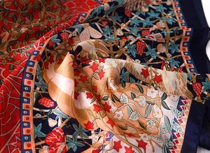Close-up of silk satin scarf with floral patterns and luxury textile texture