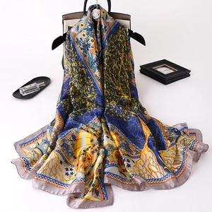 Detailed view of luxury silk scarf featuring vibrant forest motifs and bee prints