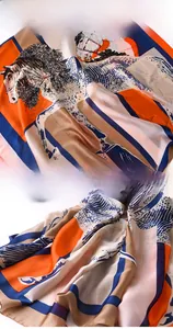 Detailed close-up showing saddle horse print and fine stitching on a satin silk scarf