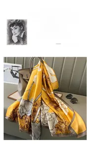Detail of silk scarf with yellow tulip print draped over a leather handbag