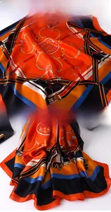 Detail of silk-satin scarf featuring orange equestrian print with precision hem stitching