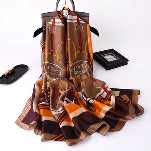Equestrian print silk-like scarf with horse harness pattern in orange and brown tones