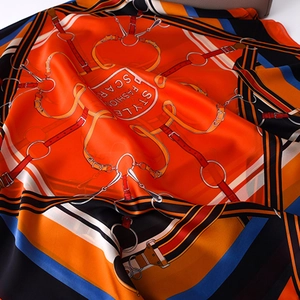 Elegant silk-satin scarf with orange equestrian belt patterns and luxury geometric print