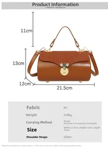 Detail view of brown PU leather box bag with vintage metal lock and pleated texture
