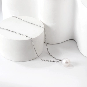 Elegant white freshwater pearl pendant necklace on silver stainless steel chain