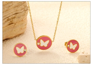 Detail of pink enamel butterfly necklace and earrings set with gold finish and zircons
