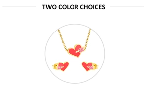 Detail of gold heart pendant necklace and stud earrings set with red enamel and arrow motif