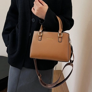 Elegant brown pebbled leather tote bag for women with stylish wide textile shoulder strap