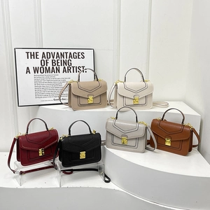 Minimalist leather crossbody handbags with gold clasp shown in six different colors