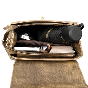 Brown vintage multi-layer crossbody bag showing spacious interior with daily essentials