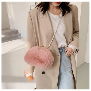 Pink faux fur crossbody bag featuring vintage gold clasp and elegant pearl chain strap