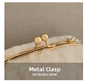 Close-up of golden ball kiss-lock clasp and soft plush texture on the shell-shaped bag
