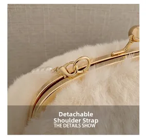 Detail showing the golden snap clasp, faux fur texture and detachable pearl strap