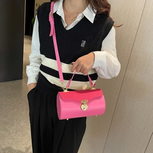 Chic pink cylinder box bag with gold twist lock and pleated detail for women