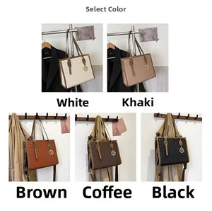 Detail of five colored faux leather tote bags with quilted patterns and V-shaped charms