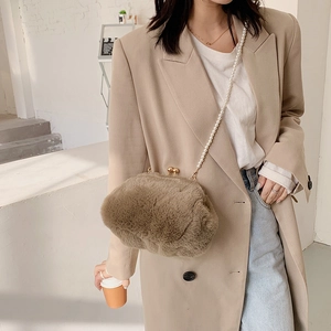Brown plush crossbody shell bag with pearl chain strap and golden ball clasp closure