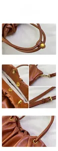 Gros plan détaillé de la poignée plissée du sac en cuir marron et boucles en laiton