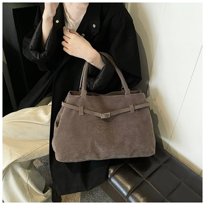 Detail of the vintage matte tote bag showing suede texture and decorative belt strap