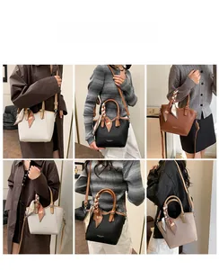Détail montrant le porté polyvalent des sacs seaux en cuir blanc, noir, marron et beige